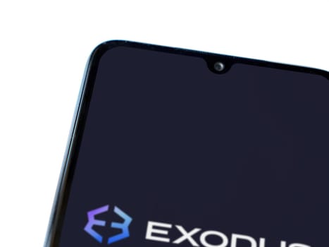 Lod, Israel - July 16,2023: Exodus app launch screen on smartphone on white background. Top view flat lay with copy space.