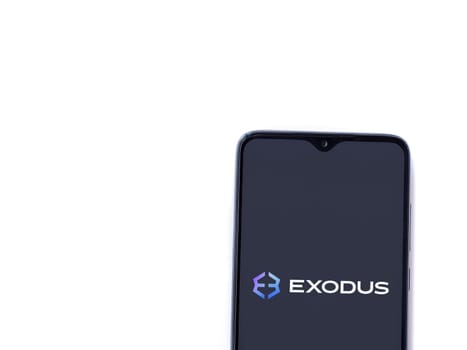Lod, Israel - July 16,2023: Exodus app launch screen on smartphone on white background. Top view flat lay with copy space.