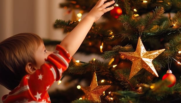 Cute little boy decorating Christmas tree at home