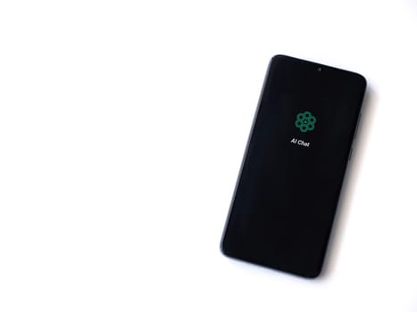 Lod, Israel - July 16,2023: Chat AI app launch screen on smartphone on white background. Top view flat lay with copy space.