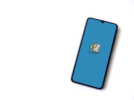 Lod, Israel - July 16,2023: Automate app launch screen on smartphone on white background. Top view flat lay with copy space.