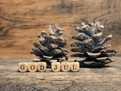 Scandinavian Merry Christmas with wooden blocks and the inscrption God Jul