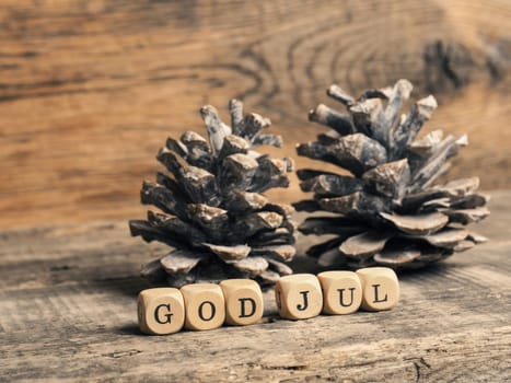 Scandinavian Merry Christmas with wooden blocks and the inscrption God Jul
