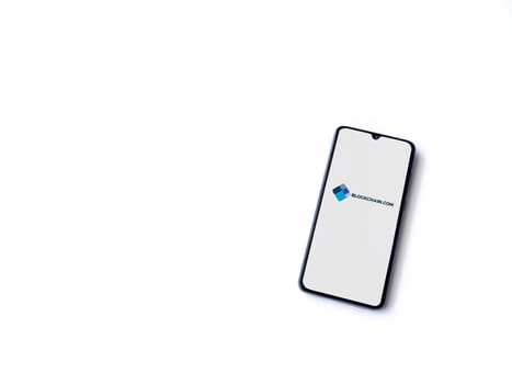 Lod, Israel - July 16,2023: Blockchain.com app launch screen on smartphone on white background. Top view flat lay with copy space.