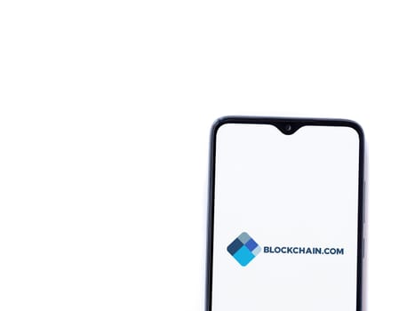 Lod, Israel - July 16,2023: Blockchain.com app launch screen on smartphone on white background. Top view flat lay with copy space.