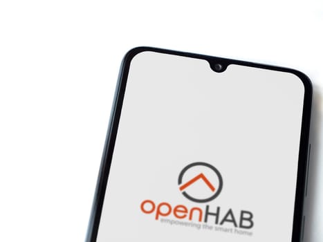Lod, Israel - July 16,2023: openHAB app launch screen on smartphone on white background. Top view flat lay with copy space.