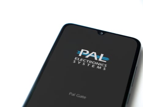 Lod, Israel - July 16,2023: PalGate app launch screen on smartphone on white background. Top view flat lay with copy space.