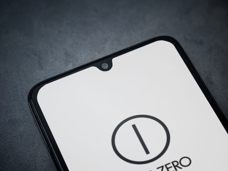 Lod, Israel - July 16,2023: One Zero app launch screen on smartphone on dark marble stone background. Top view flat lay with copy space.