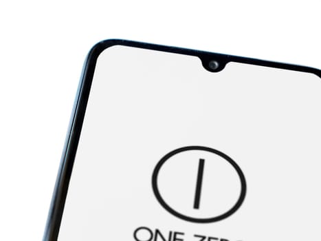 Lod, Israel - July 16,2023: One Zero app launch screen on smartphone on white background. Top view flat lay with copy space.