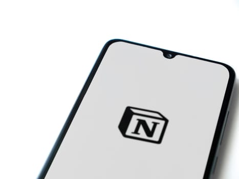 Lod, Israel - July 16,2023: Notion app launch screen on smartphone on white background. Top view flat lay with copy space.