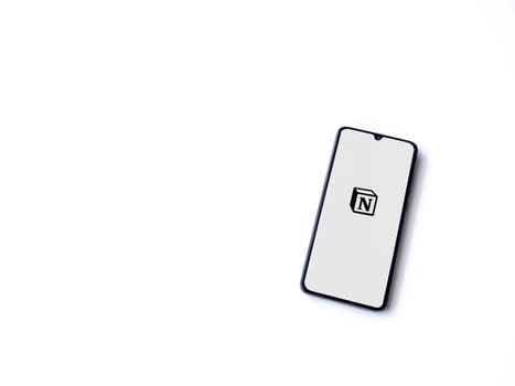 Lod, Israel - July 16,2023: Notion app launch screen on smartphone on white background. Top view flat lay with copy space.