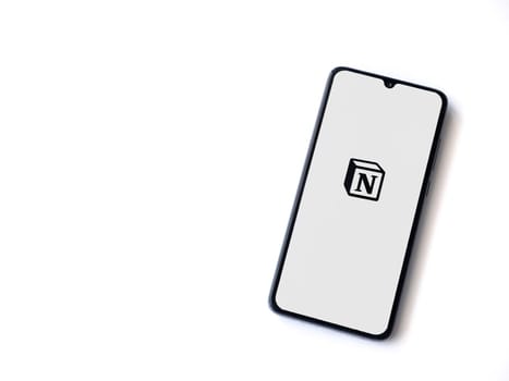 Lod, Israel - July 16,2023: Notion app launch screen on smartphone on white background. Top view flat lay with copy space.