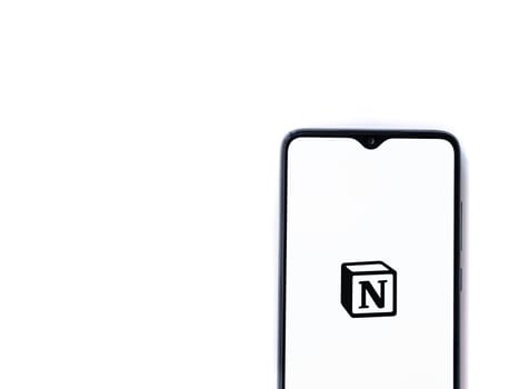 Lod, Israel - July 16,2023: Notion app launch screen on smartphone on white background. Top view flat lay with copy space.