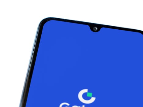 Lod, Israel - July 16,2023: Gate.io app launch screen on smartphone on white background. Top view flat lay with copy space.