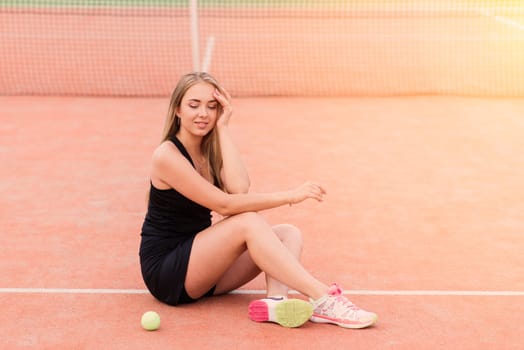 Tennis tournament. Female player at clay tennis court