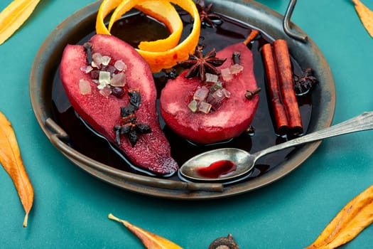 Autumn spicy pears in wine, sweet poached pears in red wine. Healthy sweet dessert.