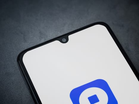 Lod, Israel - July 16,2023: Coinbase Wallet app launch screen on smartphone on dark marble stone background. Top view flat lay with copy space.