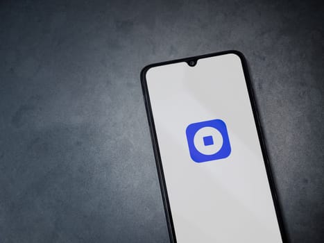 Lod, Israel - July 16,2023: Coinbase Wallet app launch screen on smartphone on dark marble stone background. Top view flat lay with copy space.