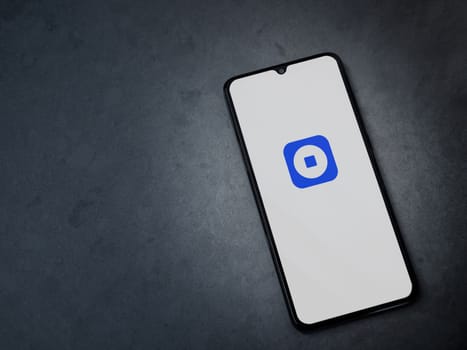 Lod, Israel - July 16,2023: Coinbase Wallet app launch screen on smartphone on dark marble stone background. Top view flat lay with copy space.