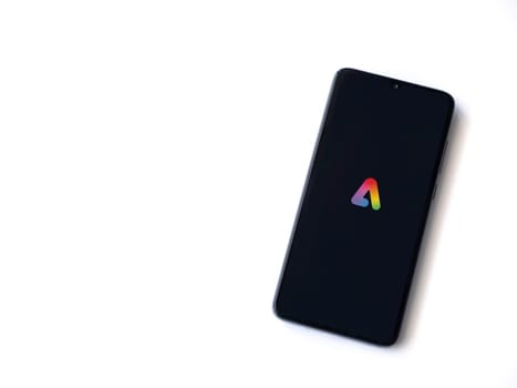 Lod, Israel - July 16,2023: Adobe Express - Graphic Design app launch screen on smartphone on white background.. Top view flat lay with copy space.