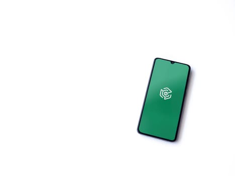 Lod, Israel - July 16,2023: Adam Ai app launch screen on smartphone on white background. Top view flat lay with copy space.