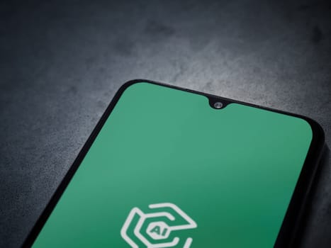 Lod, Israel - July 16,2023: Adam Ai app launch screen on smartphone on dark marble stone background. Top view flat lay with copy space.
