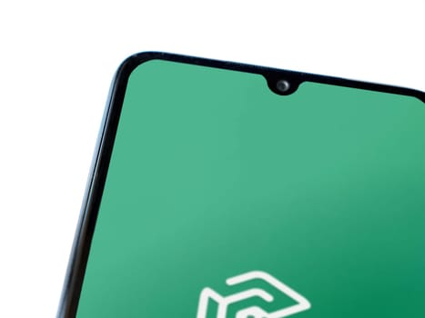 Lod, Israel - July 16,2023: Adam Ai app launch screen on smartphone on white background. Top view flat lay with copy space.