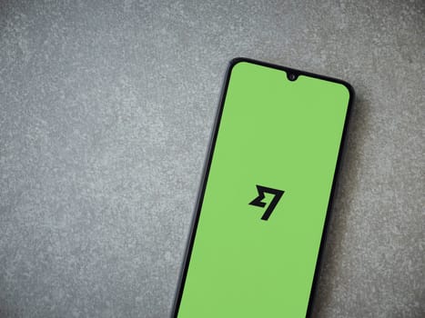 Lod, Israel - July 16,2023: Wise app launch screen on smartphone on ceramic stone background. Top view flat lay with copy space.
