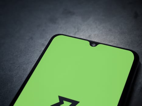 Lod, Israel - July 16,2023: Wise app launch screen on smartphone on dark marble stone background. Top view flat lay with copy space.