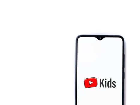 Lod, Israel - July 16,2023: YouTube Kids app launch screen on smartphone on white background. Top view flat lay with copy space.