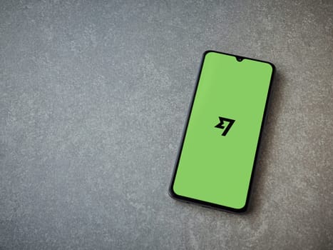 Lod, Israel - July 16,2023: Wise app launch screen on smartphone on ceramic stone background. Top view flat lay with copy space.