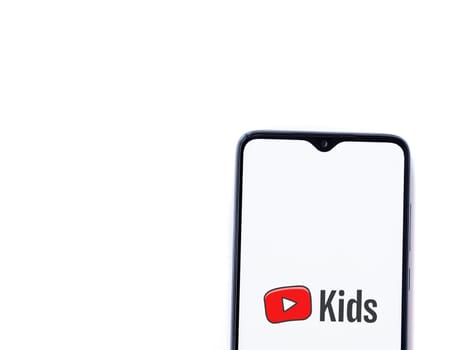 Lod, Israel - July 16,2023: YouTube Kids app launch screen on smartphone on white background. Top view flat lay with copy space.