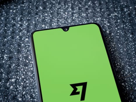 Lod, Israel - July 16,2023: Wise app launch screen on smartphone on metallic background. Close up top view flat lay.