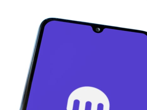 Lod, Israel - July 16,2023: Kraken app launch screen on smartphone on white background. Top view flat lay with copy space.