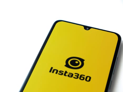 Lod, Israel - July 16,2023: Insta360 app launch screen on smartphone on white background.. Top view flat lay with copy space.