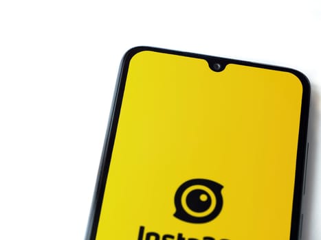 Lod, Israel - July 16,2023: Insta360 app launch screen on smartphone on white background.. Top view flat lay with copy space.