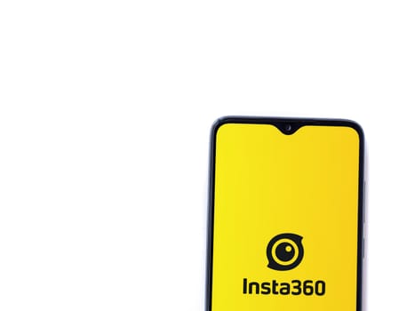 Lod, Israel - July 16,2023: Insta360 app launch screen on smartphone on white background.. Top view flat lay with copy space.