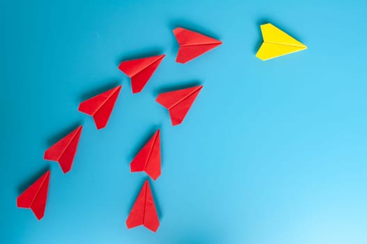 Top view of yellow paper airplanes with space for text.