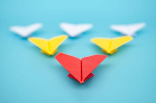 Top view of yellow paper airplanes with space for text.