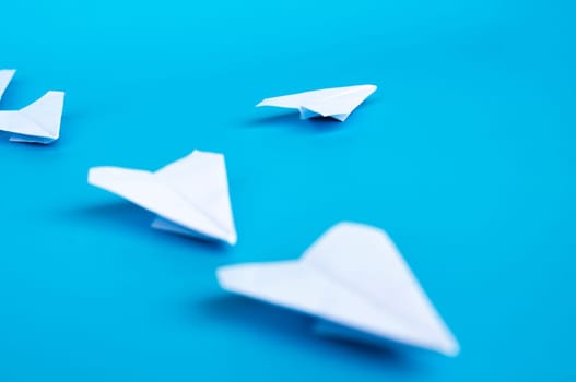 Top view of yellow paper airplanes with space for text.