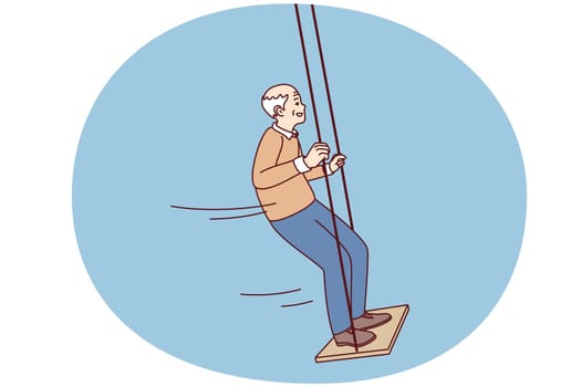Happy active elderly grandfather swinging