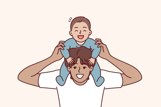 Man put baby on neck and laughed, rejoicing at presence of younger brother or beloved son. Happy young guy rolls baby and takes care of infant for concept celebrating father day and thanking parents