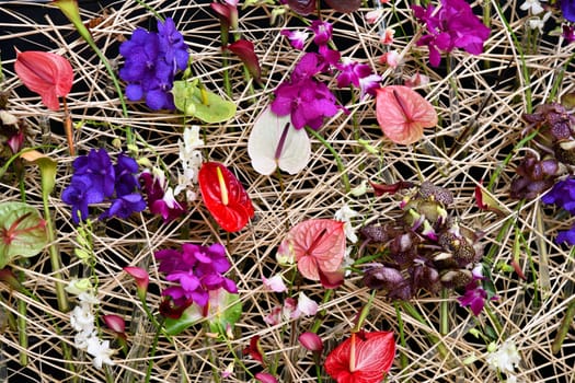 Straw wall with many different flowers