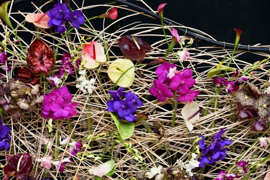 Straw wall with many different flowers