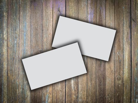 Business card blank on wooden texture background in still life and dark tone