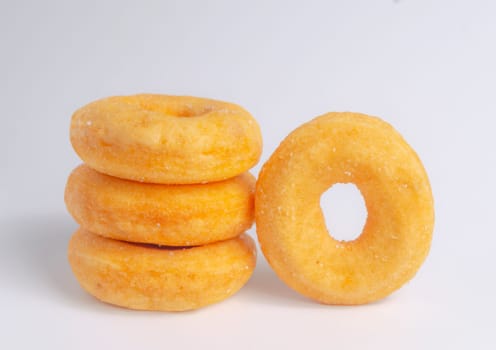 Donuts cake bakery sprinkled with sugar on white background