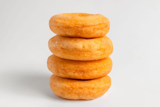 Donuts cake bakery sprinkled with sugar on white background