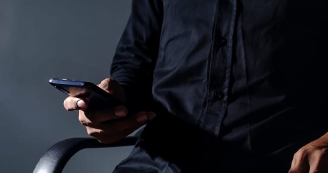 Connecting and communicating people through the network of the Internet, Business man sitting on a work chair with smartphone mobile, Networking people, People's work and transactions occur online and on the internet.