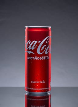 PHUKET, THAILAND - SEP. 30, 2023: Coca Cola, Can sweet and fizzy soft drink No sugar, No calories, that is popular all over the world, Dark blurred background