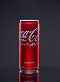 PHUKET, THAILAND - SEP. 30, 2023: Coca Cola, Can sweet and fizzy soft drink No sugar, No calories, that is popular all over the world, Dark blurred background